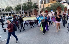 Participants in Trans March of Resilience march through downtown New Orleans. Participants in Trans March of Resilience march through downtown New Orleans.