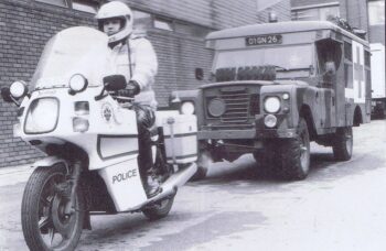 A West Midlands Police motorcyclist escorts a British Army ambulance during the 198990 strike Photo by West Midlands Police CC BYSA 20 | MR Online | A West Midlands Police motorcyclist escorts a British Army ambulance during the 1989 90 strike Photo by West Midlands Police CC BY SA 20 | MR Online