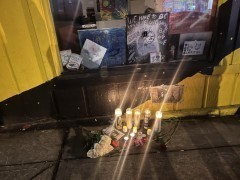 Mourners laid flowers and lit candles for Manny Paez in front of their art. Mourners laid flowers and lit candles for Manny Paez in front of their art.
