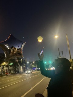 Mother of Josiah Pinner, Joanne Rojas, watches lanterns float away in his memory. Mother of Josiah Pinner, Joanne Rojas, watches lanterns float away in his memory