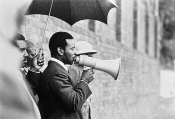 Zulu King Goodwill Zwelithini kaBhekuzulu addresses Coronation Brick workers in Durban North January 1973 Credit David Hemson Collection University of Cape Town Libraries | MR Online | Zulu King Goodwill Zwelithini kaBhekuzulu addresses Coronation Brick workers in Durban North January 1973 Credit David Hemson Collection University of Cape Town Libraries | MR Online